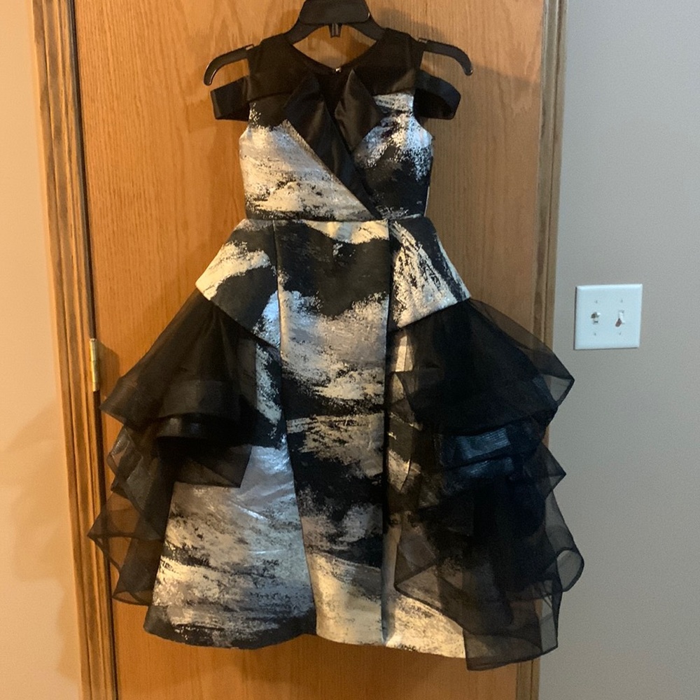 Layered pageant dress. Gold, silver, black. Horsehair trim.